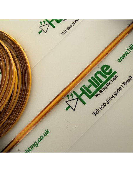 Close-up of a dotless warm white COB LED strip, 3000K, on the 5m reel