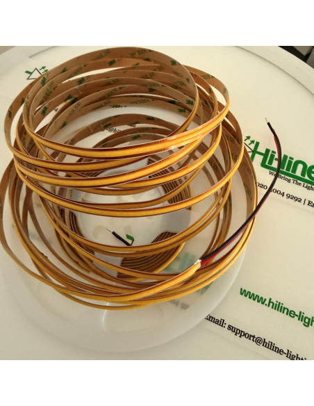 3000K warm white COB LED strip on a 10m reel, with the 24V red and black wires