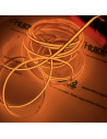 24V amber COB LED tape lit on the reel