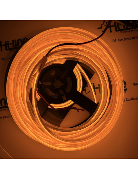 Amber COB LED strip in an IP67 silicone sleeve, 24V, switched on