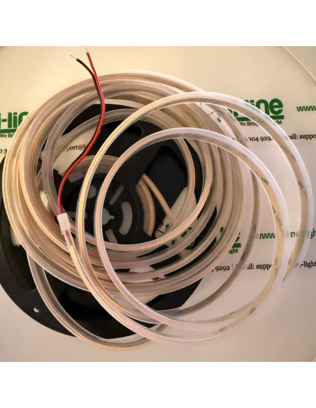 Silicone-sleeved amber COB strip coiled on the reel