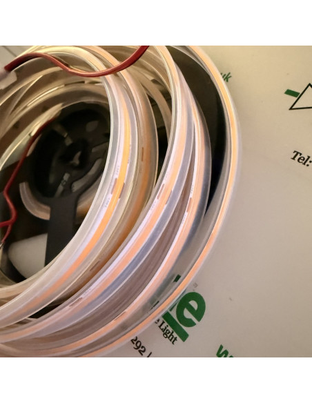Side view of the clear IP67 sleeve on the amber COB strip